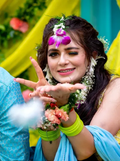 A playful wink from the bride during her haldi. These are the candid, personality-filled moments I love to capture.