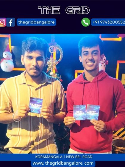 Another pair of laser tag champions with their awards.