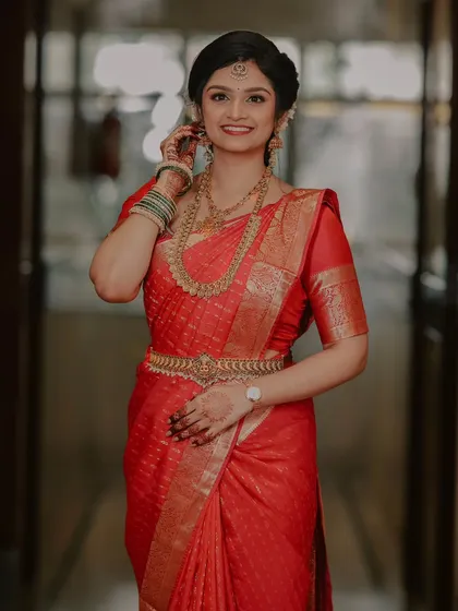 Another beautiful portrait of the bride, capturing her elegant pose and the intricate details of her traditional engagement attire.
