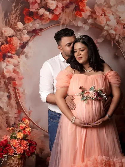 A tender moment between this couple, framed by the beautiful boho floral ring. The soft peach gown complements the warm floral tones perfectly.