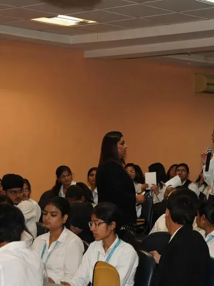 Engaging with a law student during the Q&A session. These interactions are vital for inspiring the next generation of advocates to fight for justice.