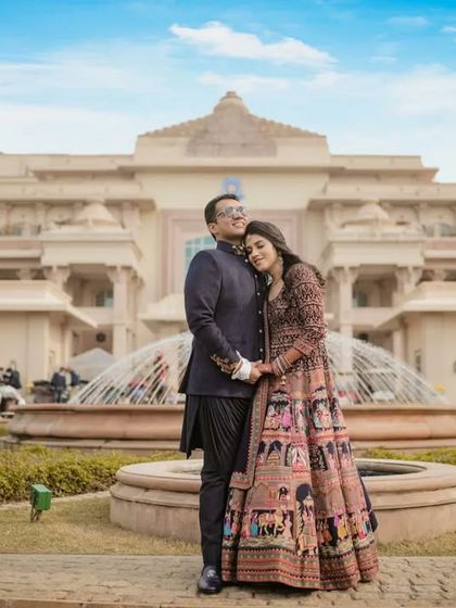 A grand portrait of Deepali and Anmol at the ITC Grand Bharat. We use the magnificent architecture of luxury hotels to create a sense of opulence for our couples.