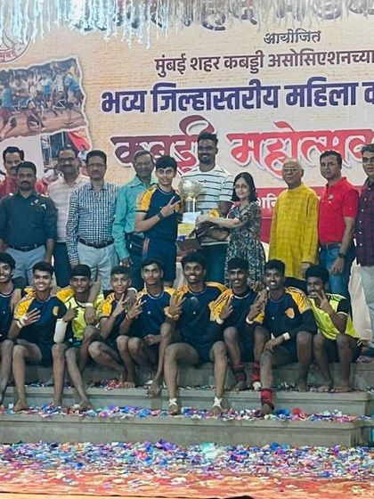 The junior team on the victory stage, covered in confetti after being crowned champions.