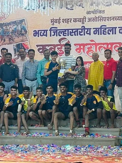 The junior team on the victory stage, covered in confetti after being crowned champions.