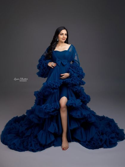 Pure happiness in blue. This gorgeous ruffled gown in a deep royal blue makes a powerful and elegant statement, perfectly capturing the joy of this special time.