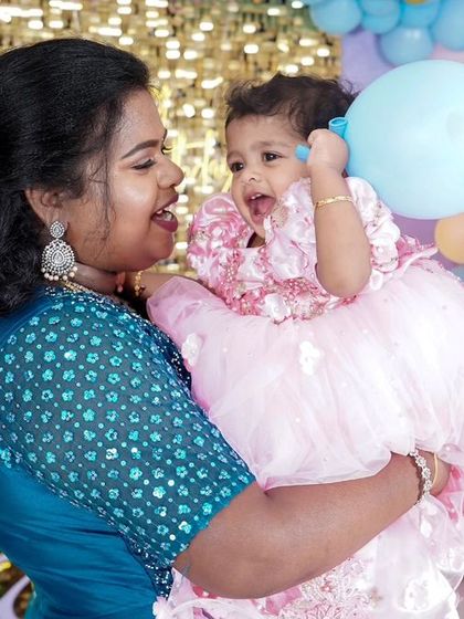 A charming 'Baby Shark' themed birthday party, featuring a vibrant underwater backdrop, character cutouts of the shark family, and blue and yellow balloons, perfect for a fun-filled celebration.