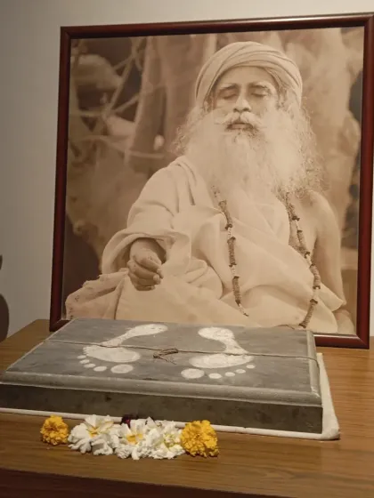 Sadhguru's padukas (sacred footprints) placed at the Sannidhi, a constant reminder of the Guru's grace that guides our every step on this path.