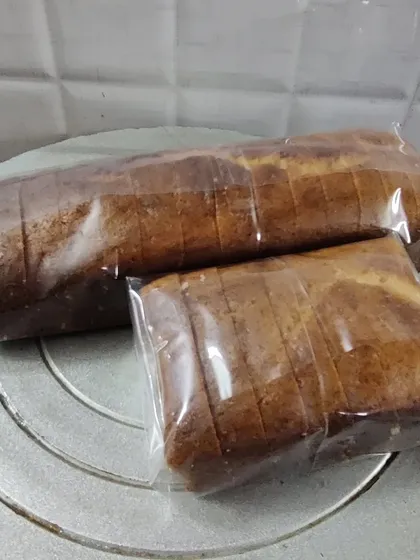 Two Mawa Rawa loaf cakes of different sizes, sliced and wrapped. I can bake them in various sizes depending on your needs.