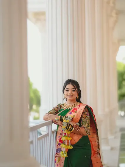 A graceful bride-to-be posing for her Haldi photos. We created her custom yellow floral jewellery with delicate kalire to match her beautiful green and orange saree.