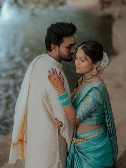 An intimate and artistic shot of the couple. The focus is on their connection, with the bride's beautiful profile and hairstyle highlighted.