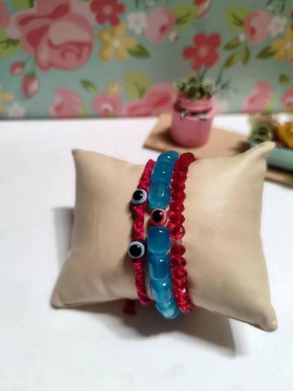 My collection of handmade bracelets, available in many colors and styles. I use beads, evil eye charms, and macrame techniques to create these stackable pieces.