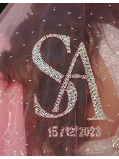 A close-up of the stunning beadwork on the personalized bridal veil. I work with designers to ensure these custom details are crafted to perfection.