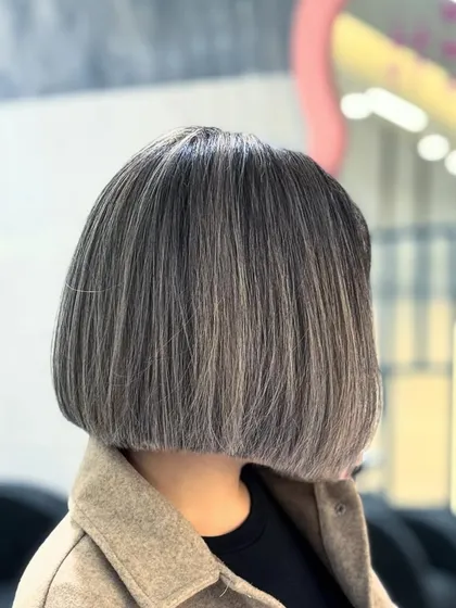 The back of this ash bob, showing the clean lines and beautiful color blend. A great cut looks good from every angle.