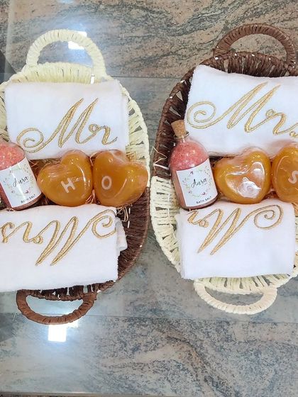 I also offer more affordable and compact hamper options. These lovely baskets include 'Mr' and 'Mrs' embroidered towels, heart-shaped initial soaps, and a bottle of my homemade bath salts.