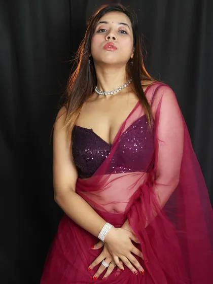A more dramatic portrait from our purple lehenga shoot. The upward angle and the model's pose create a sense of confidence and power.
