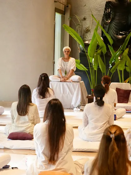 I am here to hold space for you. In our sessions, surrounded by the peaceful energy of the Sangat (our community), we journey inward. This image captures the stillness and focus we cultivate together, allowing each person to connect with their own inner wisdom.