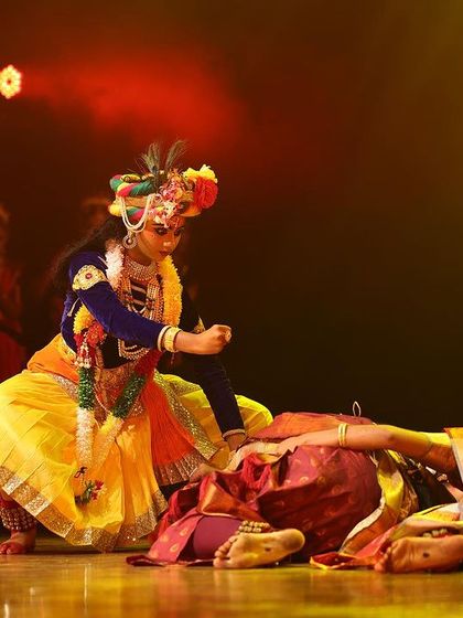 A dynamic scene from our "Nrithya Milanam 2023" festival, featuring a moment from the "KRISHNA" story. This highlights how we integrate our productions into larger cultural events.