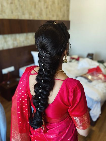 Another shot of the pearl-adorned braid, showcasing its classic beauty.