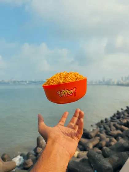 Brand content can be playful and surreal. For Yippee! Noodles, I created this levitation shot against the iconic Marine Drive, turning a simple snack into a magical moment that stops the scroll and captures the imagination.