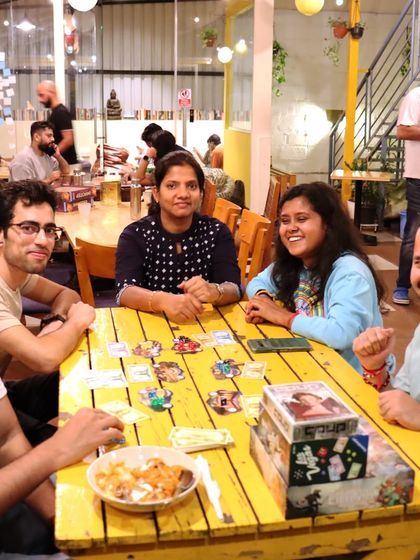 The joy and excitement of a game well played. This happy group captures the energy of our board game meetups.