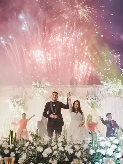 The grand finale of a Sangeet performance, complete with fireworks. We capture the peak moments of your celebration, creating images that are full of energy and excitement.