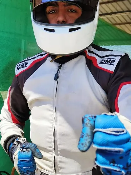 A duplicate shot of a driver in his helmet.