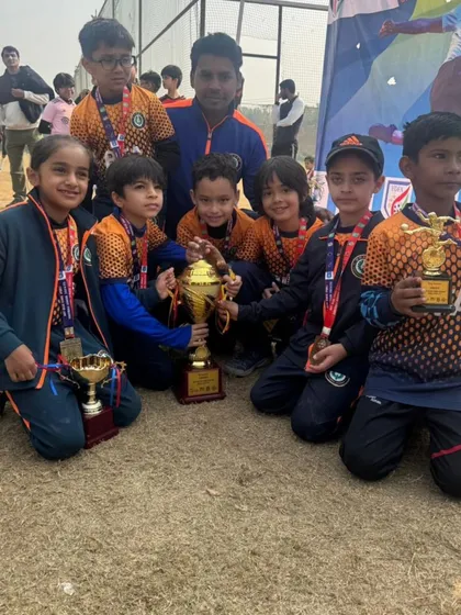 The spoils of victory. Our Under 8 champions with their coach and a collection of trophies from the Blue Cubs Football League.