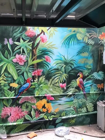 A vibrant jungle scene with colorful parrots and flowers, painted on an exterior wall to create a lively and exotic atmosphere.
