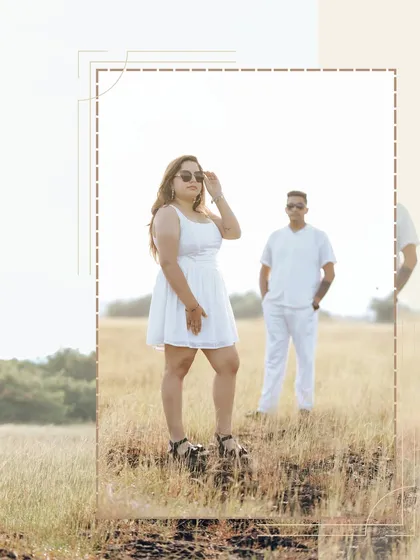 A stylish portrait in a sunlit field in Goa. The bright, airy feel of this shot is perfect for capturing the happy, carefree vibe of a coastal pre-wedding.