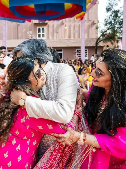 A warm family hug, a moment of connection and love during the vibrant Mayra festivities.