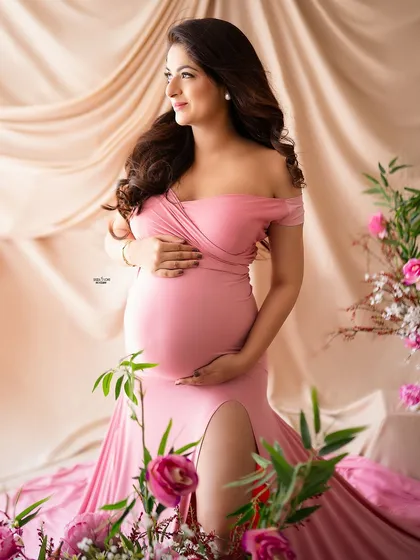 A closer look at our glamorous floral setup, focusing on the mother's radiant expression. We'll practice capturing both wide shots and intimate portraits within the same set.