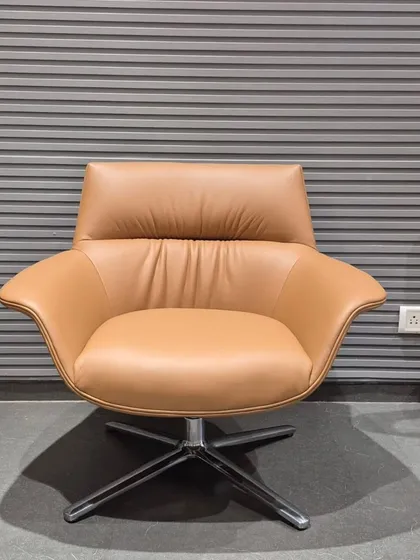 The same swivel lounge chair design is also available in a classic tan color.