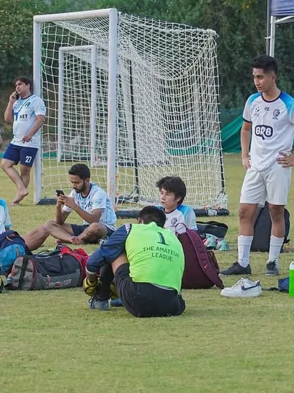 The team debriefing on the sidelines during a break. We constantly analyze and adapt our strategy.