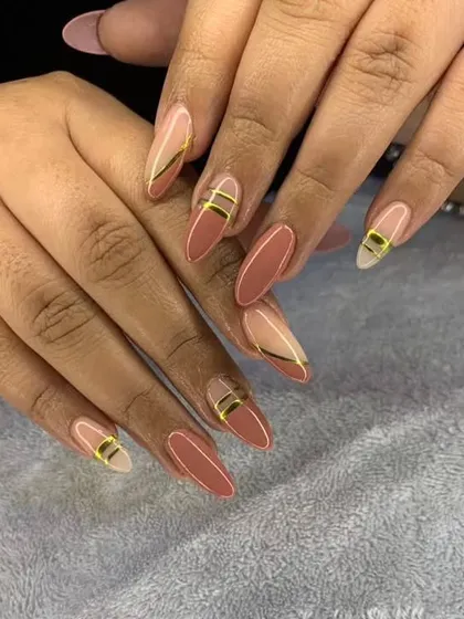 A sophisticated design with a dusty rose base and delicate gold line accents.