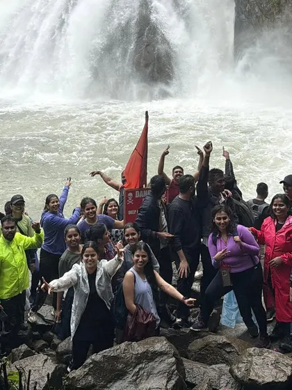 The pure joy of reaching Dudhsagar Falls. Our groups celebrate the power and beauty of this magnificent "Sea of Milk," a highlight of our monsoon trekking season in Goa.