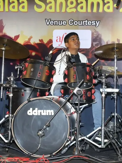 A young drummer in action during the 'Bones' cover at Kalaa Sangama 2023.