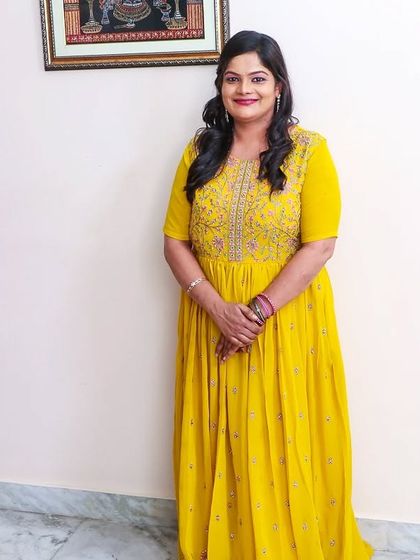 A full-length view of the simple and elegant look for a birthday party celebration.