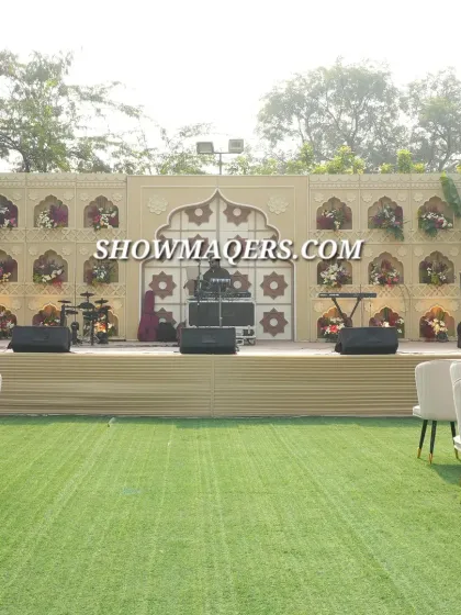 The stage setup for the Banaras-themed event, featuring an ornate backdrop with jali work, ready for a live performance.