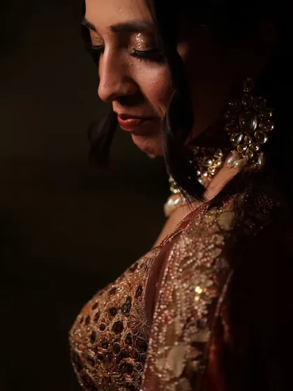 A side profile of the soft engagement makeup. This angle highlights the delicate shimmer on the eyes and the subtle contouring that enhances her features.