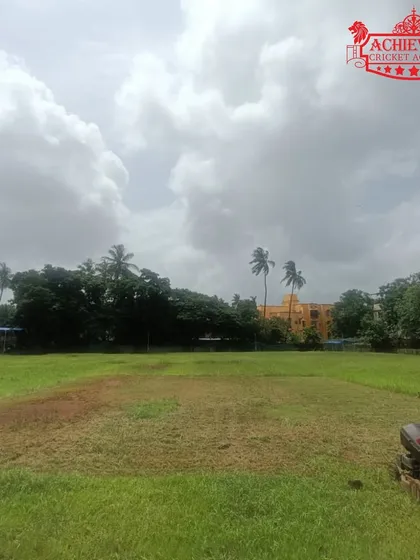 The pitch is ready. A freshly prepared ground under a cloudy sky, waiting for the action to begin.
