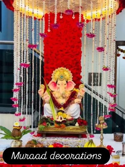 Here, I created a divine atmosphere for Ganesh Chaturthi with a backdrop of dense red flowers and cascading strings of white floral garlands. The lighting is designed to highlight the idol and create a warm, inviting glow.