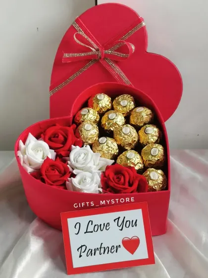 A classic heart-shaped box with Ferrero Rocher, roses, and a personalized "I Love You Partner" card.