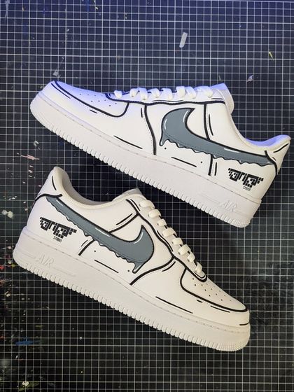 A clean and simple Cartoon Drip Air Force 1. The cartoon-style outlines and dripping swoosh give the classic white AF1 a unique, animated look.