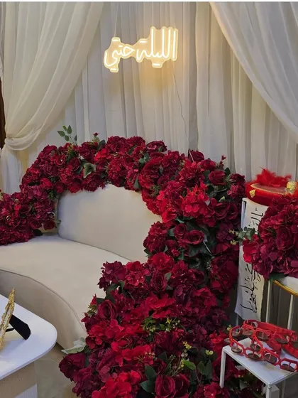Make a bold statement with this custom floral sofa. I covered this piece in hundreds of red roses to create a unique and luxurious seating for a special celebration.