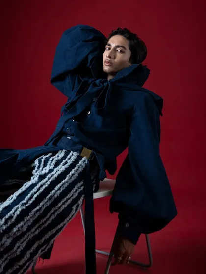 A seated pose that still feels powerful and dynamic. The composition is all about angles and attitude for this high-fashion editorial.