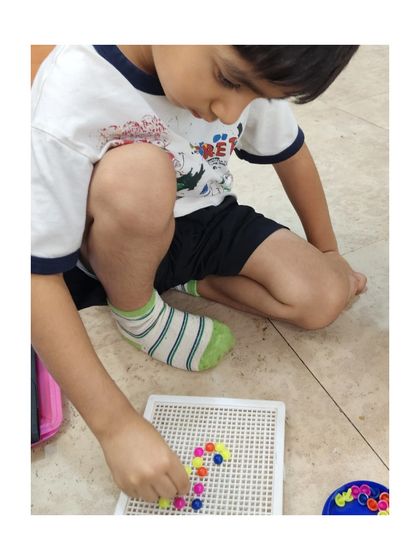We encourage children to create their own designs on the pegboard, fostering creativity alongside important motor skill development.