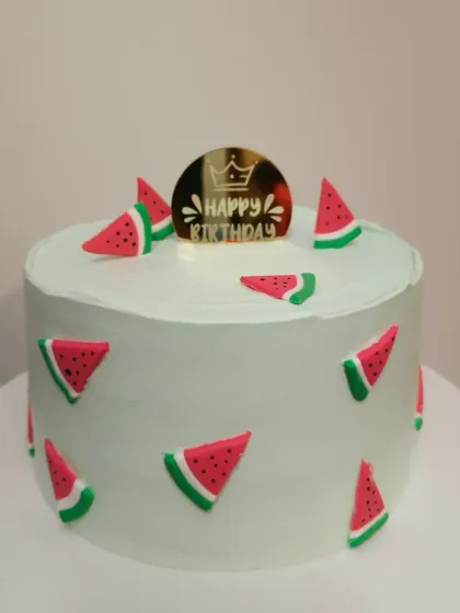 A fun and fresh watermelon themed cake, perfect for a summer birthday.