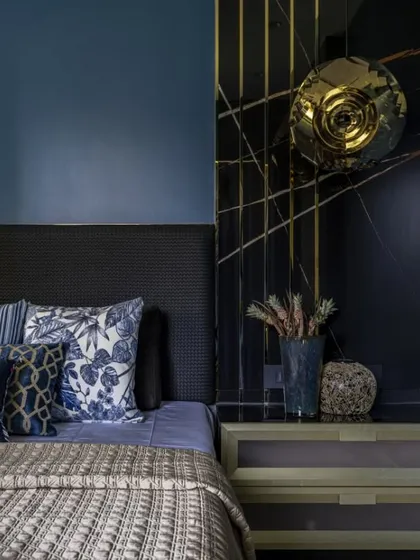 When the client's son asked for a bold, blunt blue, I took it a step further. Midnight blue walls, graphite veneer, and a marble bed-back come together in a masterclass of restraint, balance, and drama.