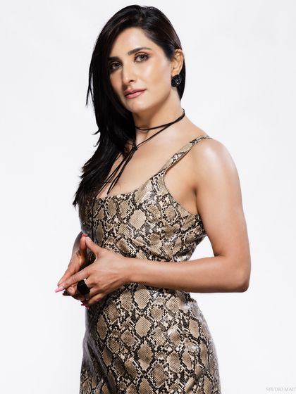 A three-quarter portrait with a serious and confident pose.