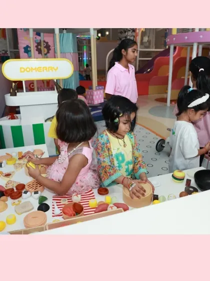 Little chefs busy at work during a Barbie-themed party. The pretend food station is always a hit.
